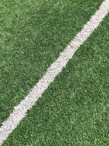 A close-up image of a football pitch